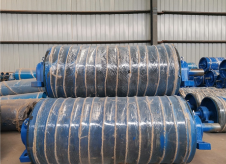Rubber covered conveyor pulleys in factory workshop